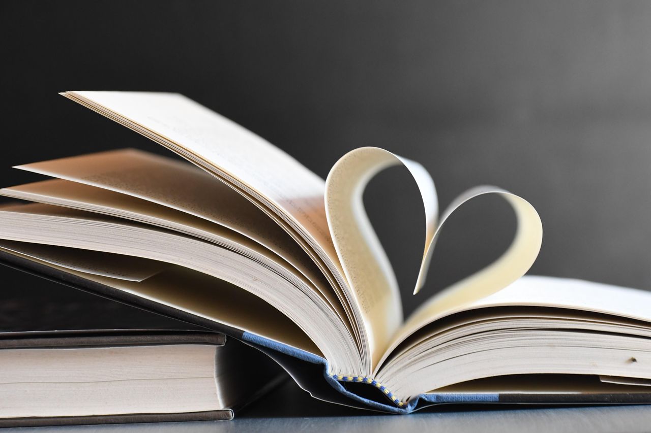 Offerings Open book with pages forming a heart, symbolizing love for reading and literature.